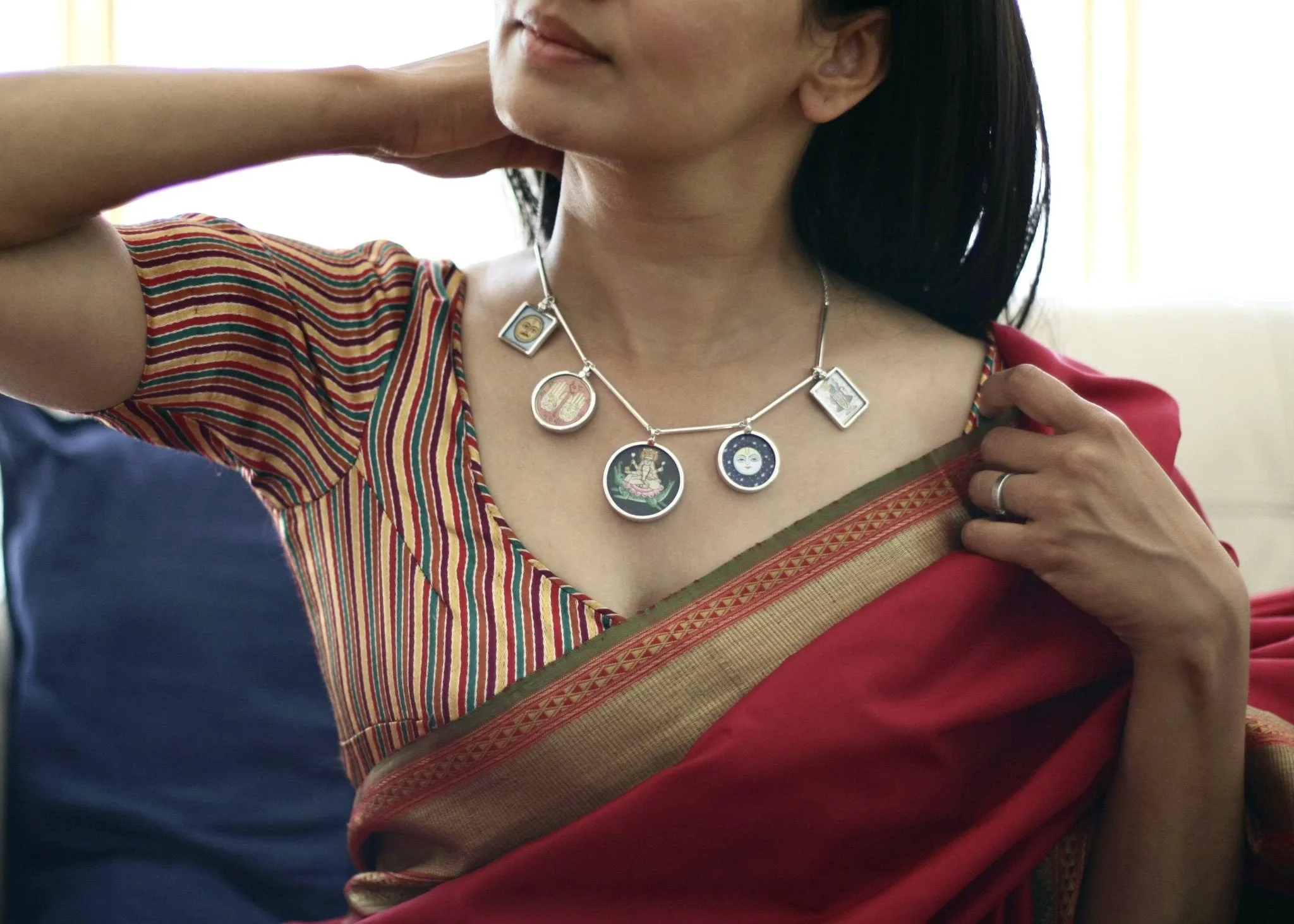 Dramatic, conversation-starting, linked necklace with miniature painting pendants