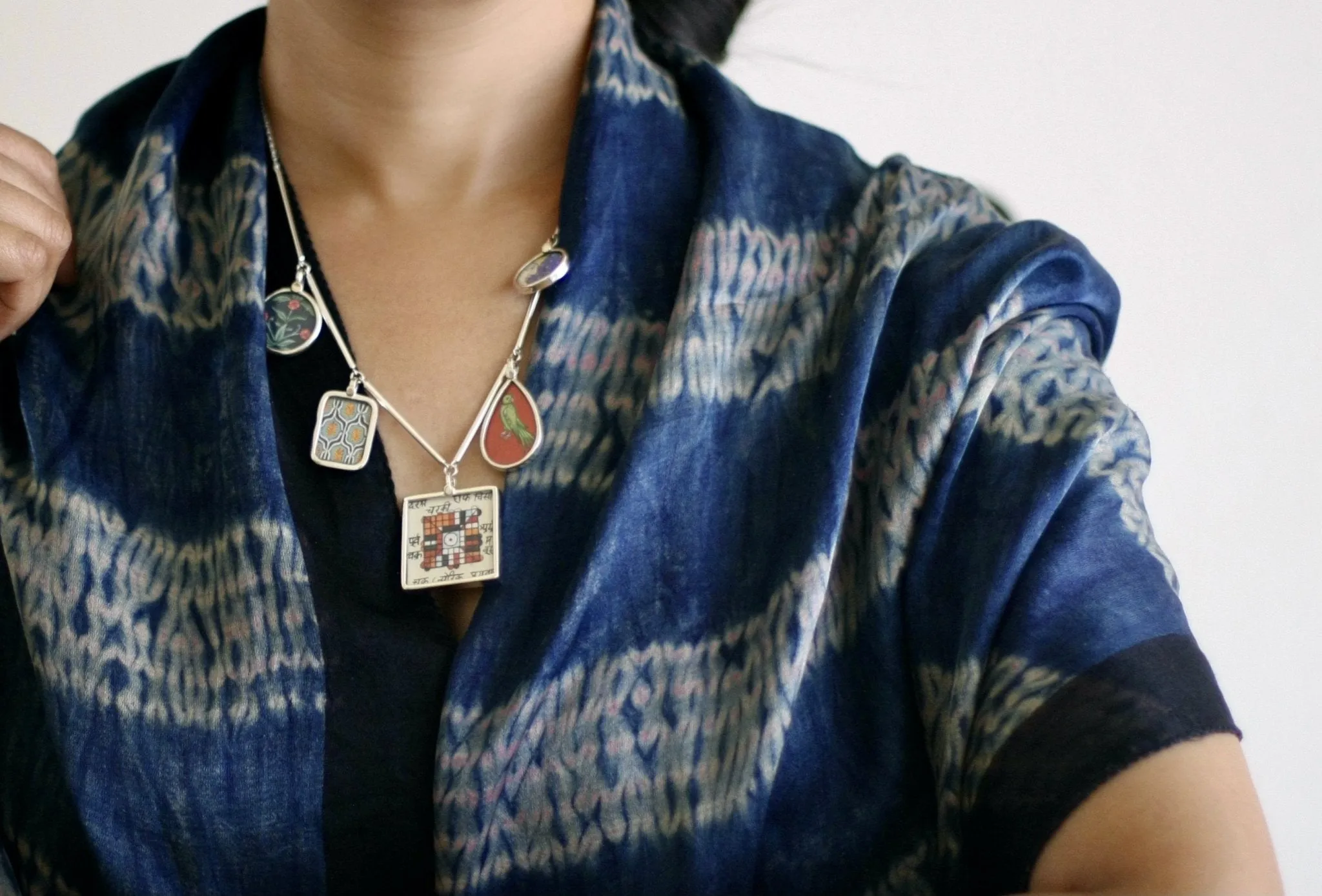 Dramatic, conversation-starting, linked necklace with miniature painting pendants