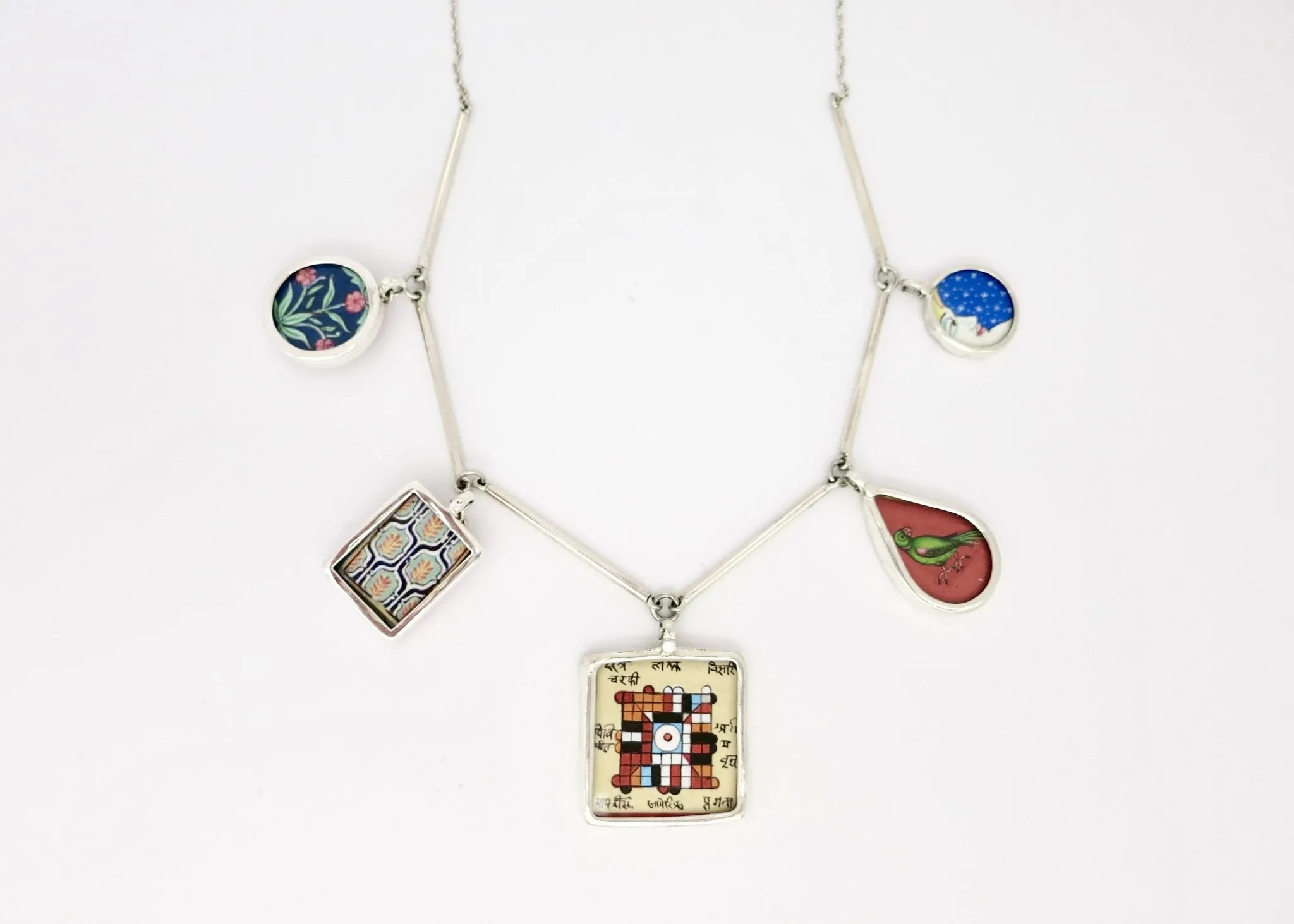 Dramatic, conversation-starting, linked necklace with miniature painting pendants