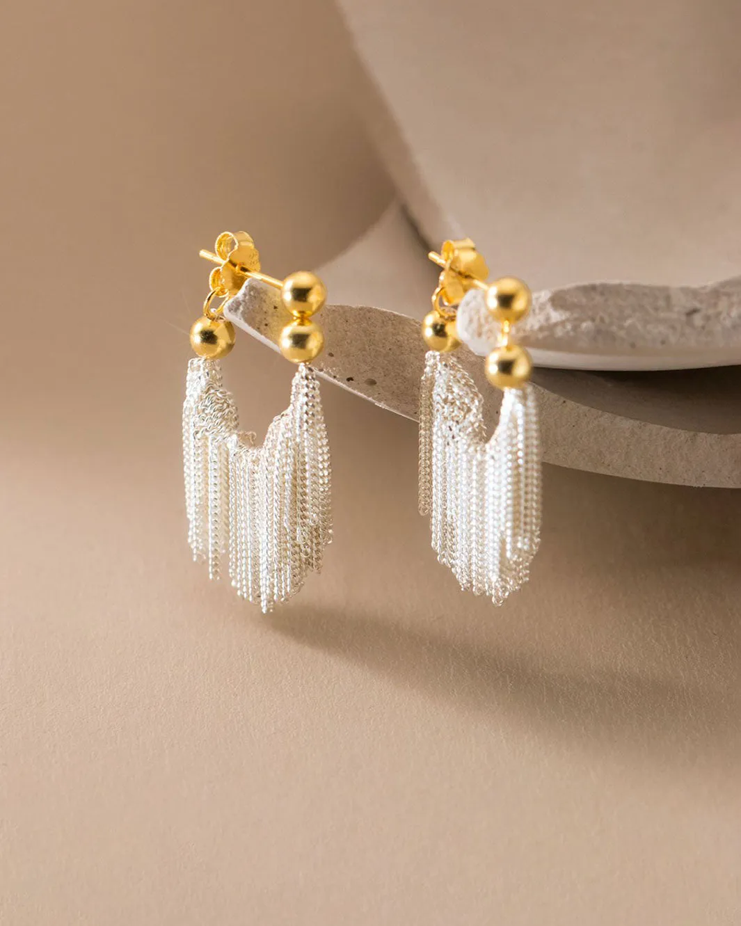 Dual Tone Gleaming Tassel Earrings