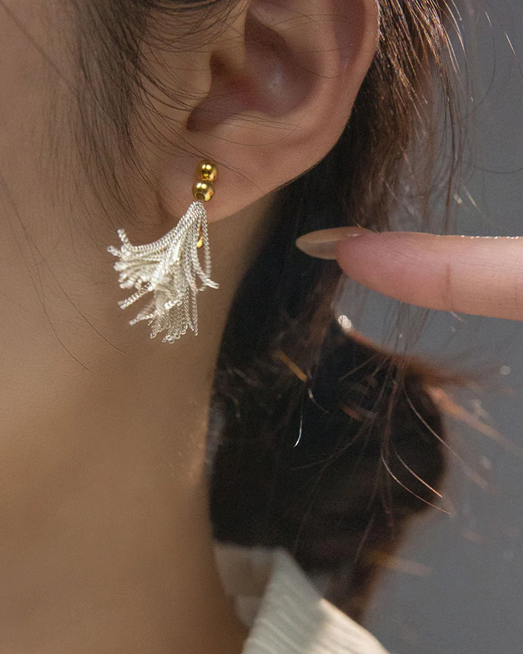 Dual Tone Gleaming Tassel Earrings