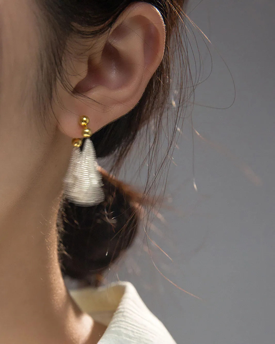 Dual Tone Gleaming Tassel Earrings