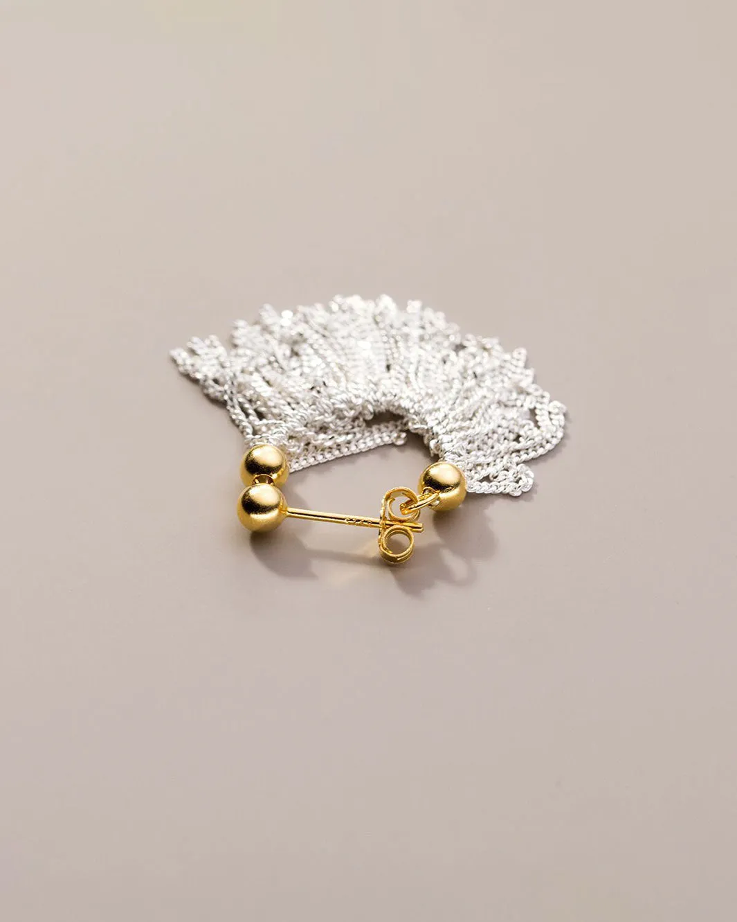 Dual Tone Gleaming Tassel Earrings