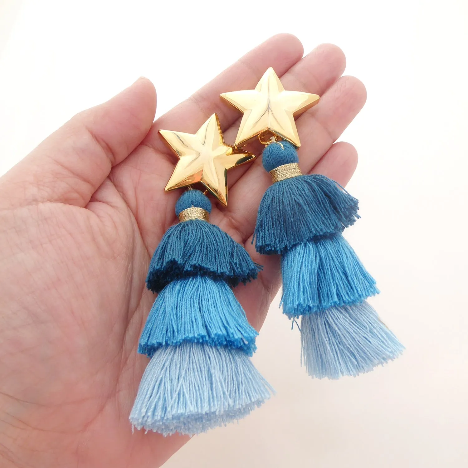 Gold star and teal tassel earrings