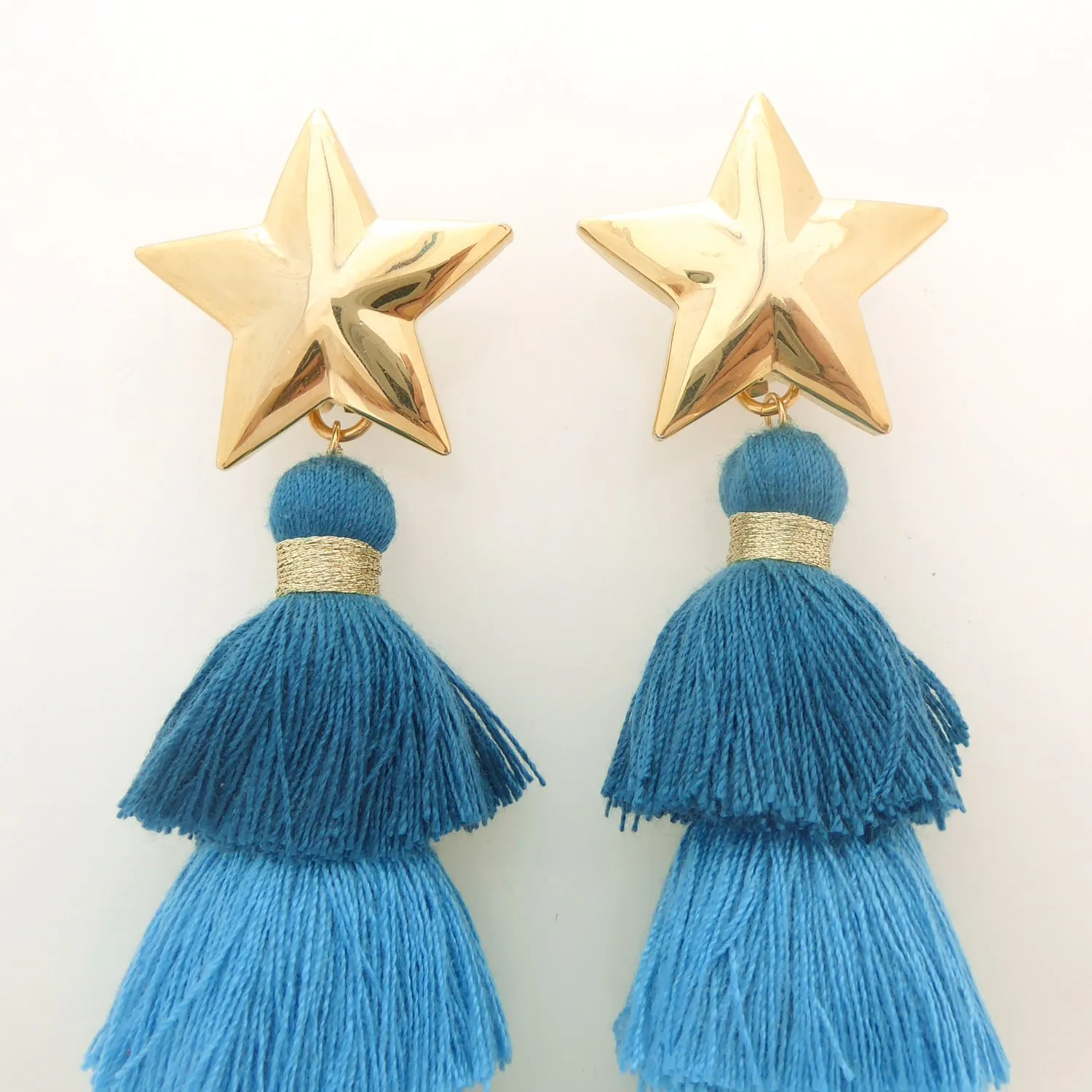 Gold star and teal tassel earrings