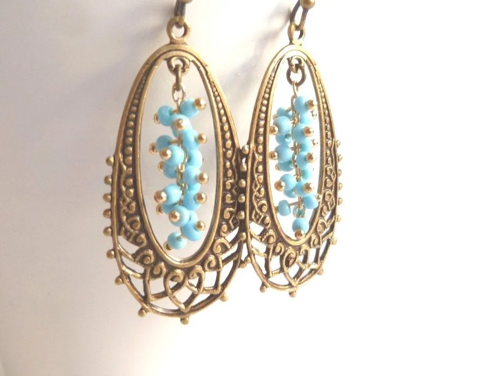 Long Oval Earrings - elongated lacy filigree in antique brass/bronze with tiny blue bead cluster center - fancy decorative boho