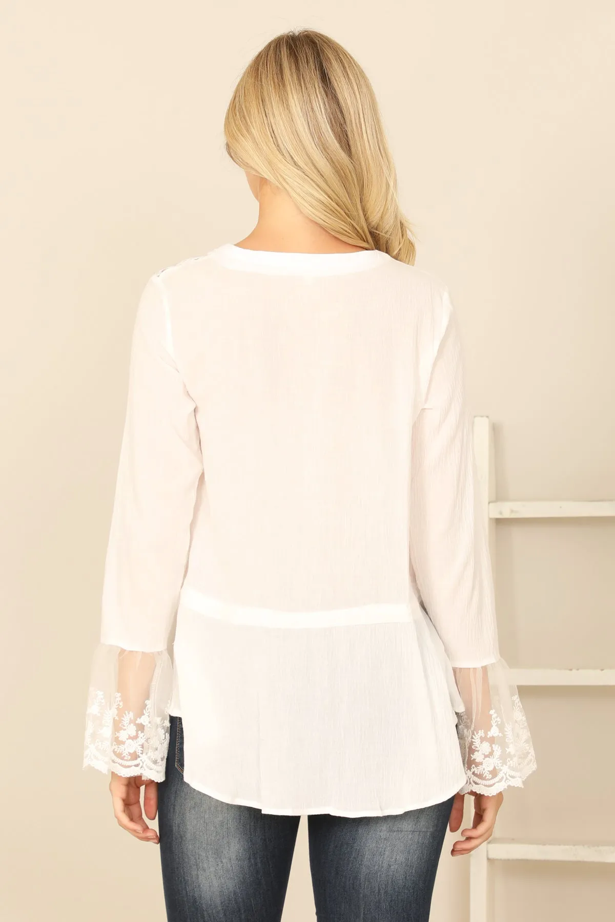 PLEATED FRONT WITH TASSEL LACE DETAIL LONG SLEEVE TOP