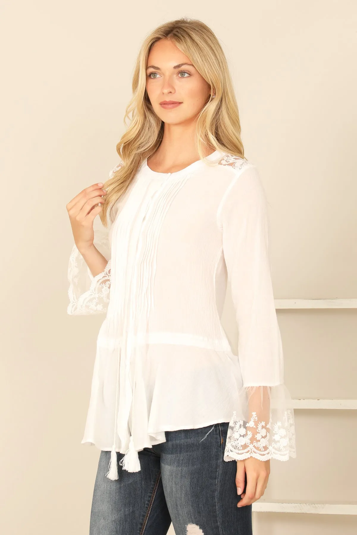 PLEATED FRONT WITH TASSEL LACE DETAIL LONG SLEEVE TOP